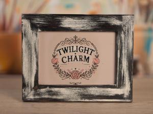 a picture frame with the words twilight charm on it