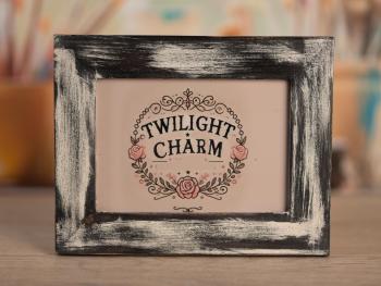 a picture frame with the words twilight charm on it